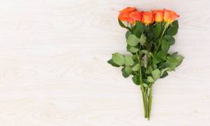 Why Orange Roses and Red Hypericum Bouquets Make a Thoughtful Hostess Gift