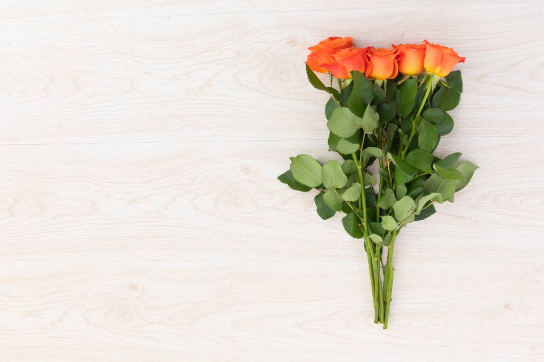 Why Orange Roses and Red Hypericum Bouquets Make a Thoughtful Hostess Gift